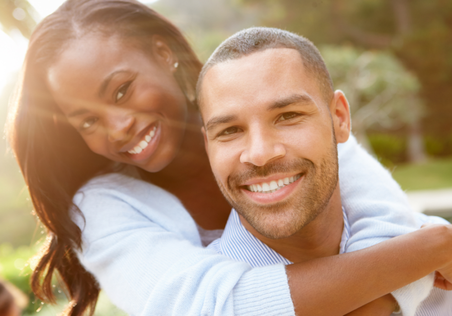 couple hugging and smiling what makes a man sexually attractive