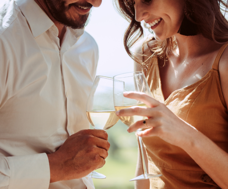 couple drinking wine outdoors dating red flags in 50s